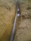 Waste pipe and repaired water main underneath.JPG